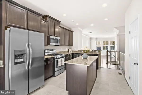 a view of entryway with wooden floor and stairs