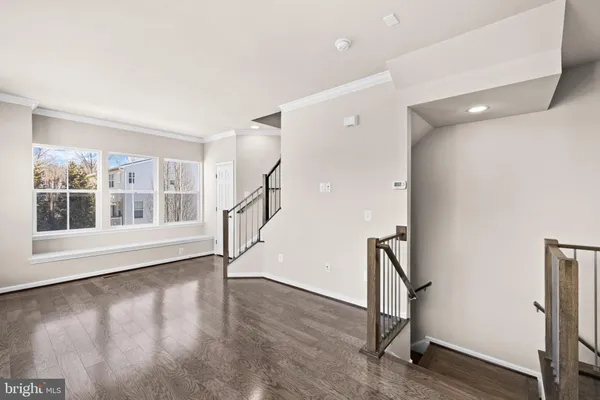 a view of an entryway with wooden floor and a window