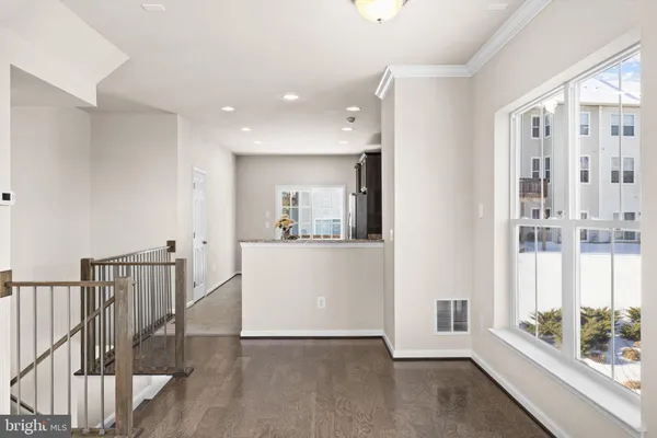 a view of an entryway with wooden floor