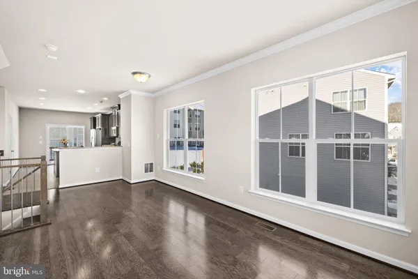 a living room with furniture or couch and a large window
