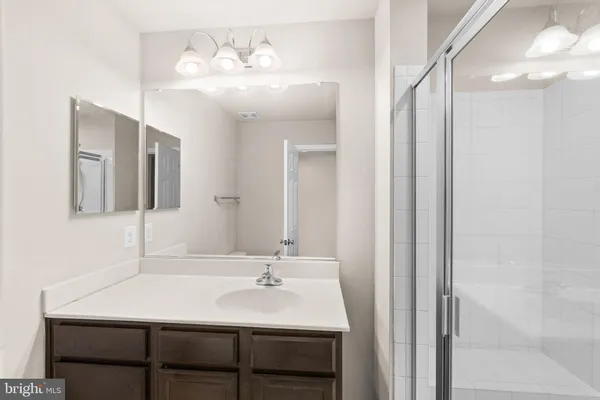 a bedroom with a large bed and a large window