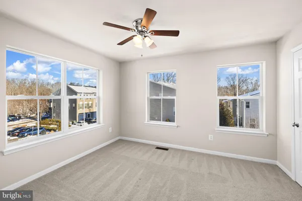 a view of an empty room with stairs