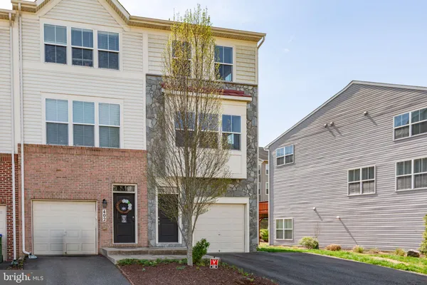 a kitchen with granite countertop a sink and cabinets