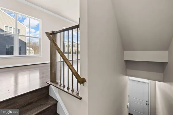 a kitchen with stainless steel appliances granite countertop a stove refrigerator and microwave