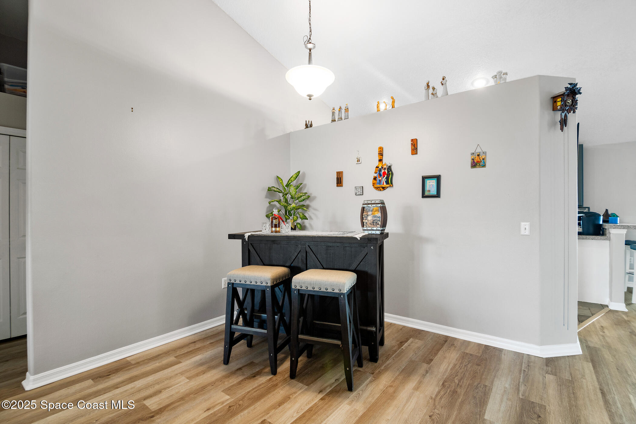 443 Wenthrop Circle Rockledge, FL 32955 - Photo 11 of 38 a view of a dining room with furniture and wooden floor