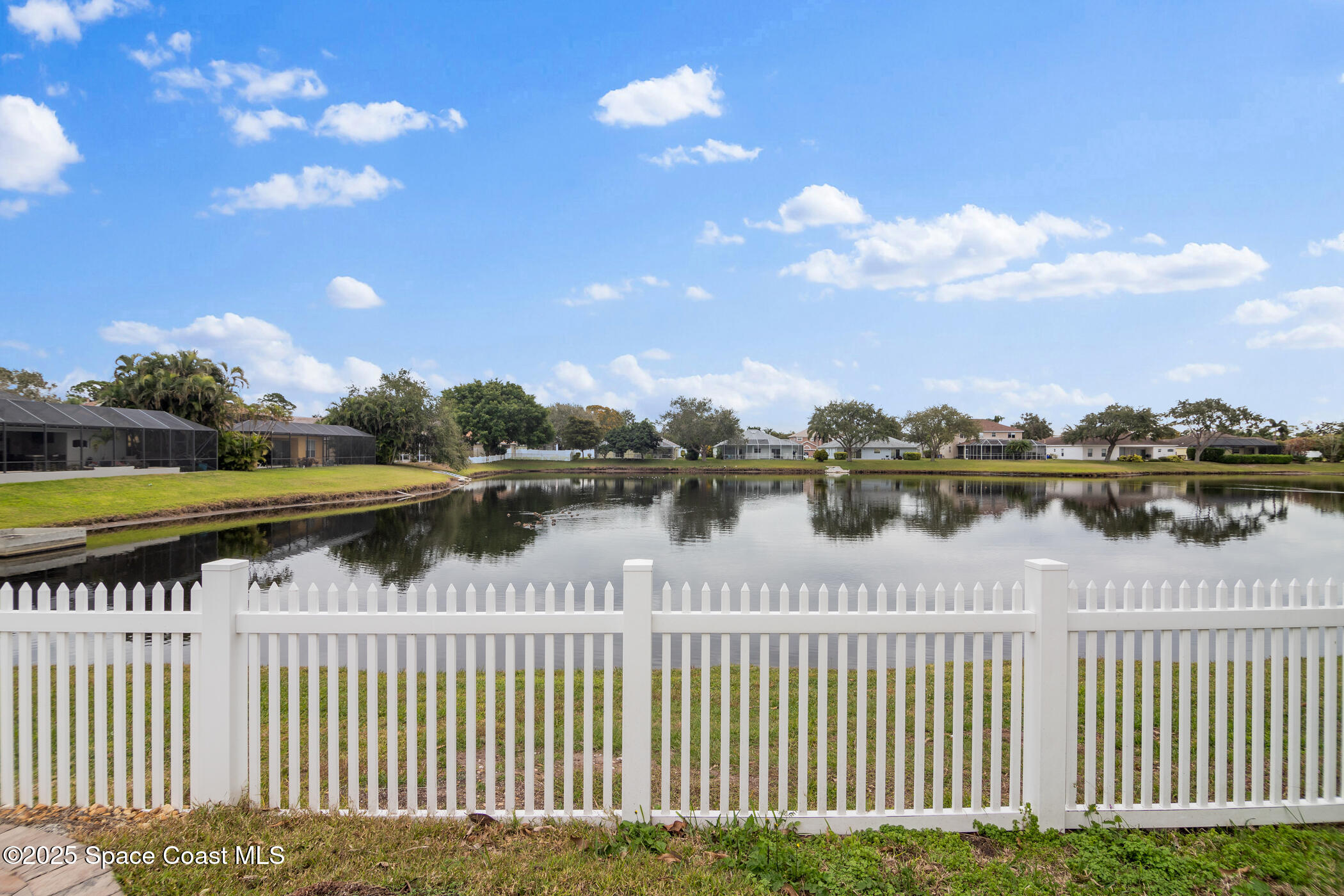 443 Wenthrop Circle Rockledge, FL 32955 - Photo 29 of 38 a view of a lake with a city