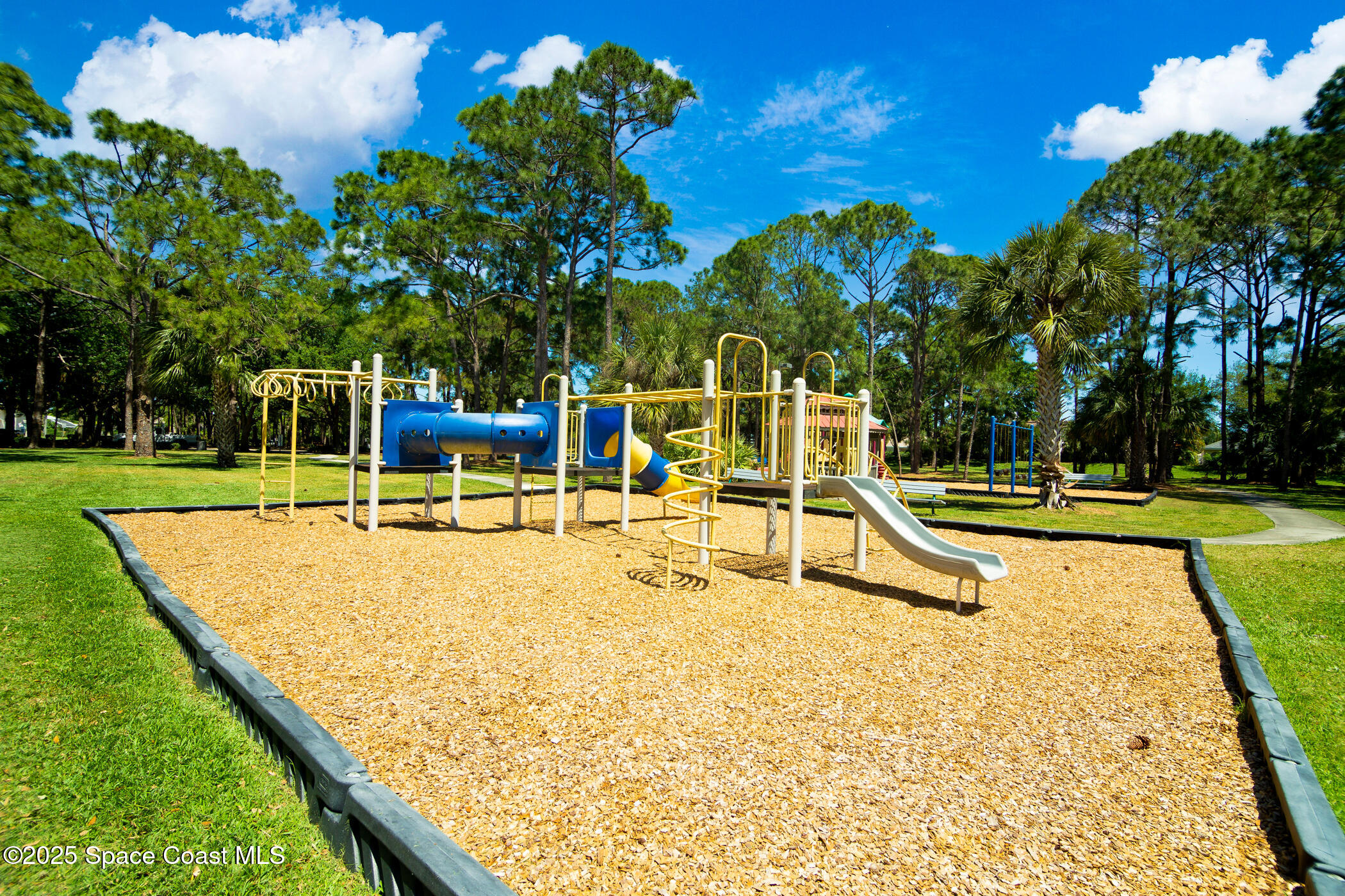 443 Wenthrop Circle Rockledge, FL 32955 - Photo 35 of 38 a view of a swimming pool with a bench
