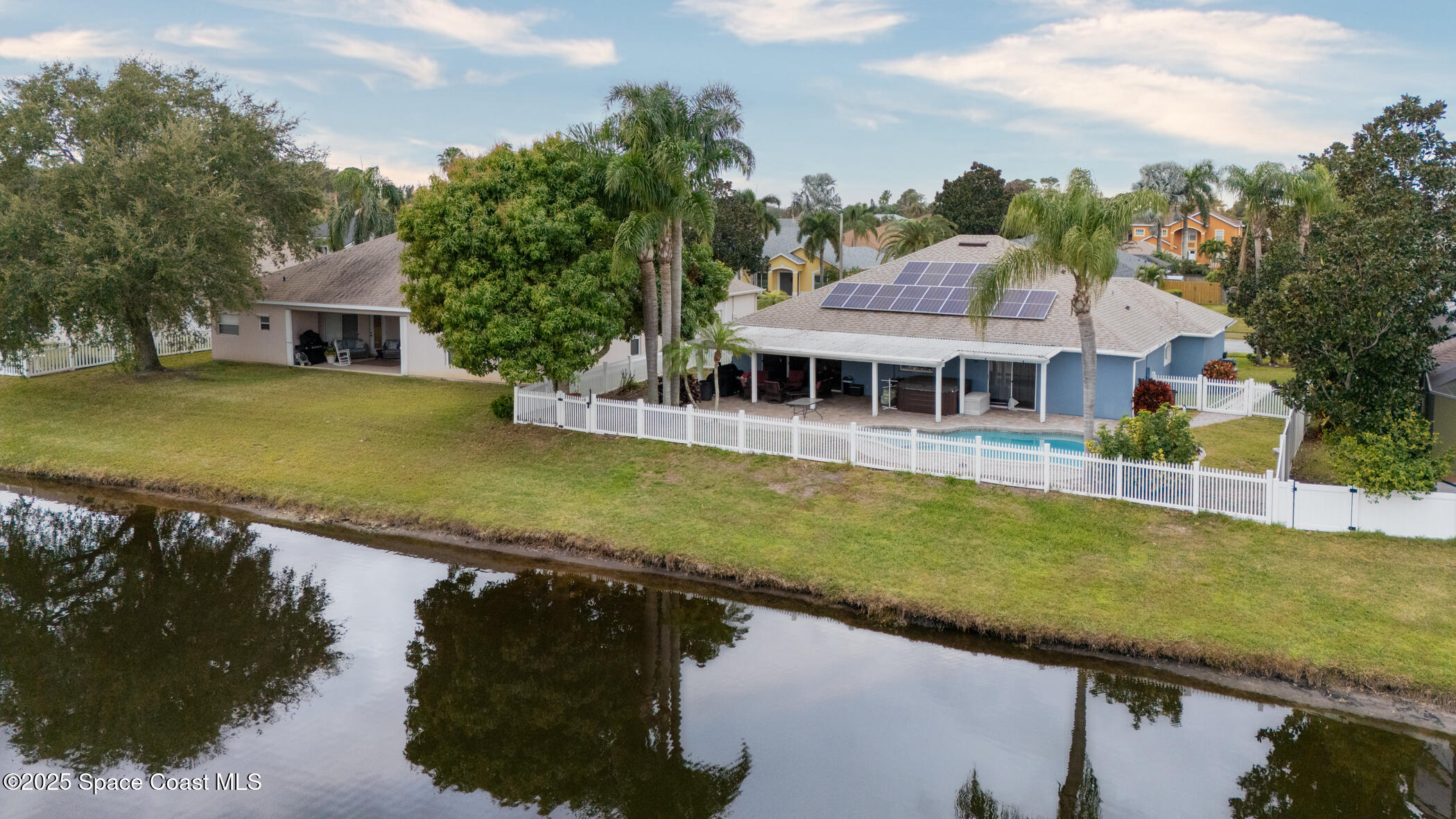 443 Wenthrop Circle Rockledge, FL 32955 - Photo 6 of 38 a view of a house with pool and chairs