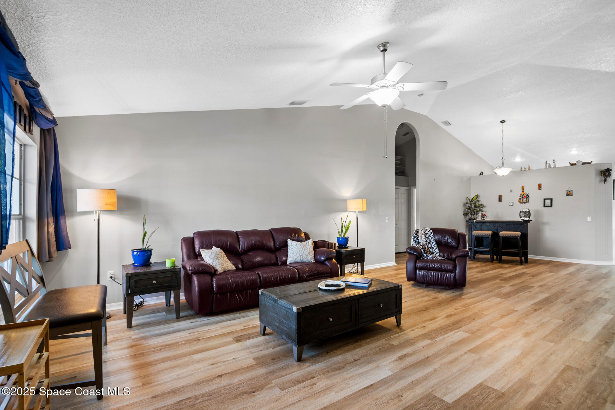 443 Wenthrop Circle Rockledge, FL 32955 - Photo 8 of 38 a living room with furniture and wooden floor