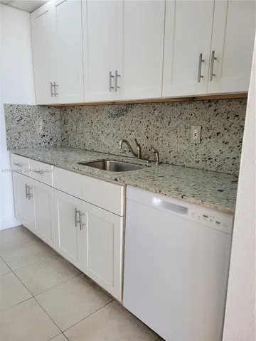 a view of an empty room with glass door