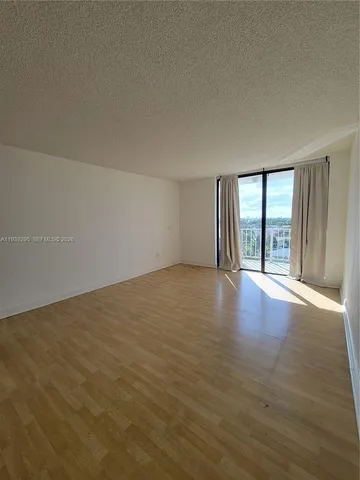 a view of a room with wooden floor and small space