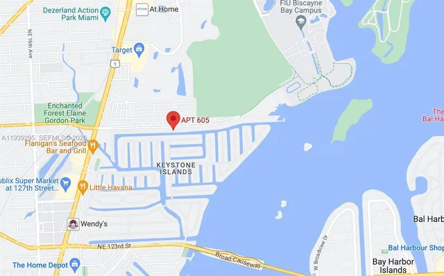 a kitchen with granite countertop white cabinets and a white appliances