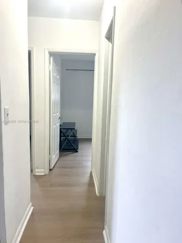 a view of a bedroom from a hallway