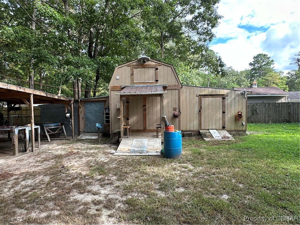 7809 Ark Road Gloucester, VA 23061 - Photo 28 of 32 View of outdoor structure with a yard