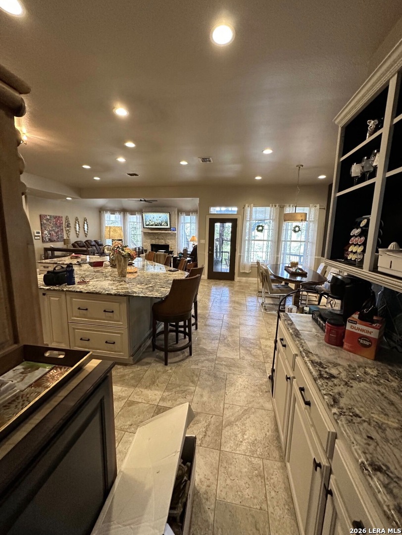 359 Park Ridge Boerne, TX 78006 - Photo 5 of 10 a kitchen with stainless steel appliances granite countertop a sink stove and cabinets