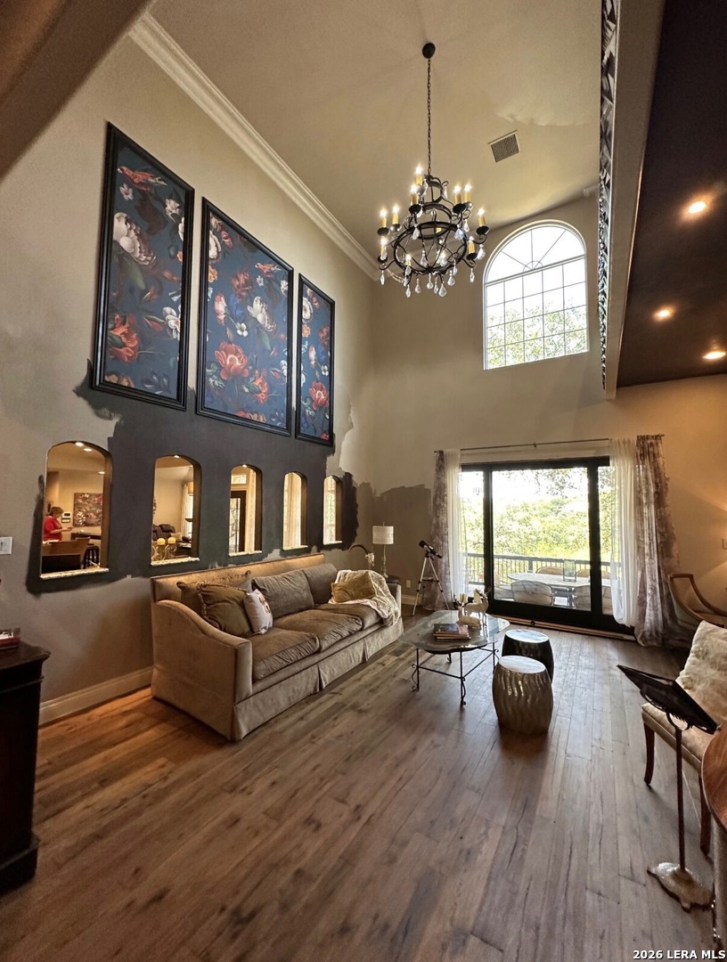 359 Park Ridge Boerne, TX 78006 - Photo 8 of 10 a living room with furniture or couch and a chandelier