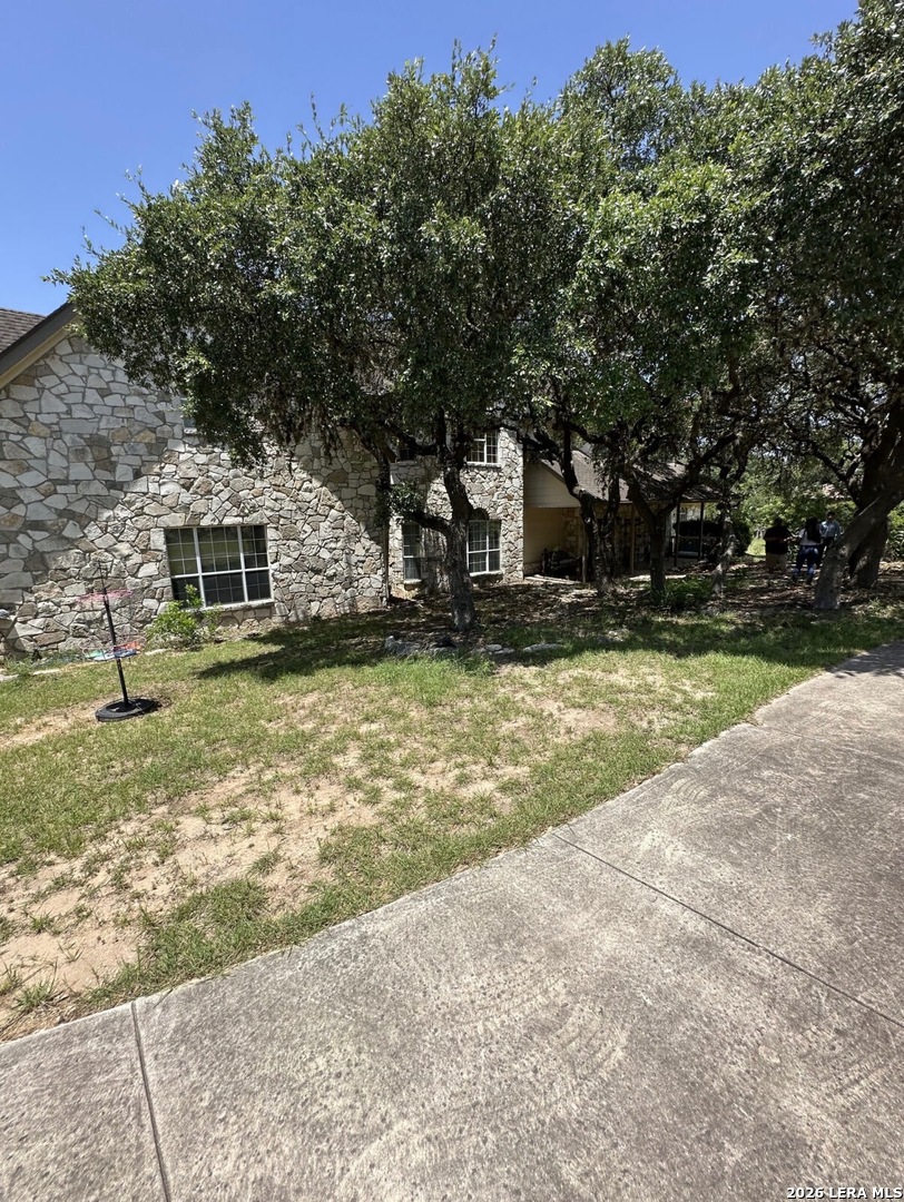 359 Park Ridge Boerne, TX 78006 - Photo 10 of 10 a front view of a house with a yard garage and outdoor seating