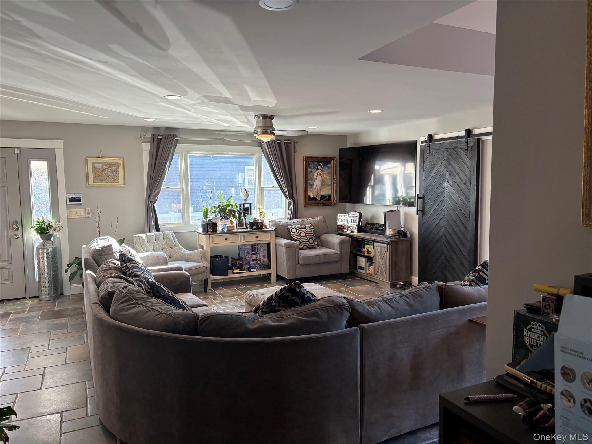 40 Alton Road Babylon, NY 11702 - Photo 16 of 41 Living area with a barn door and recessed lighting