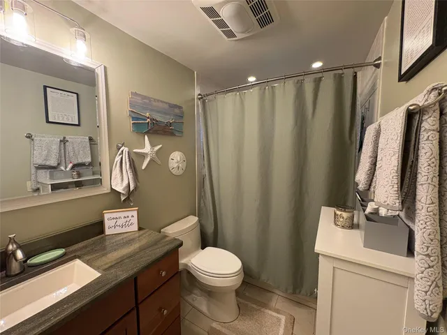 a bathroom with a tub and a shower