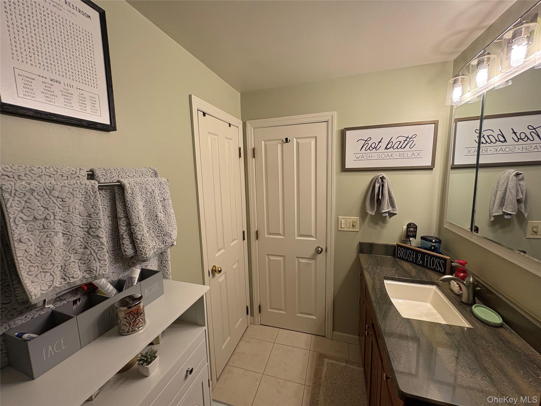 40 Alton Road Babylon, NY 11702 - Photo 24 of 41 Bathroom featuring vanity and light tile patterned floors