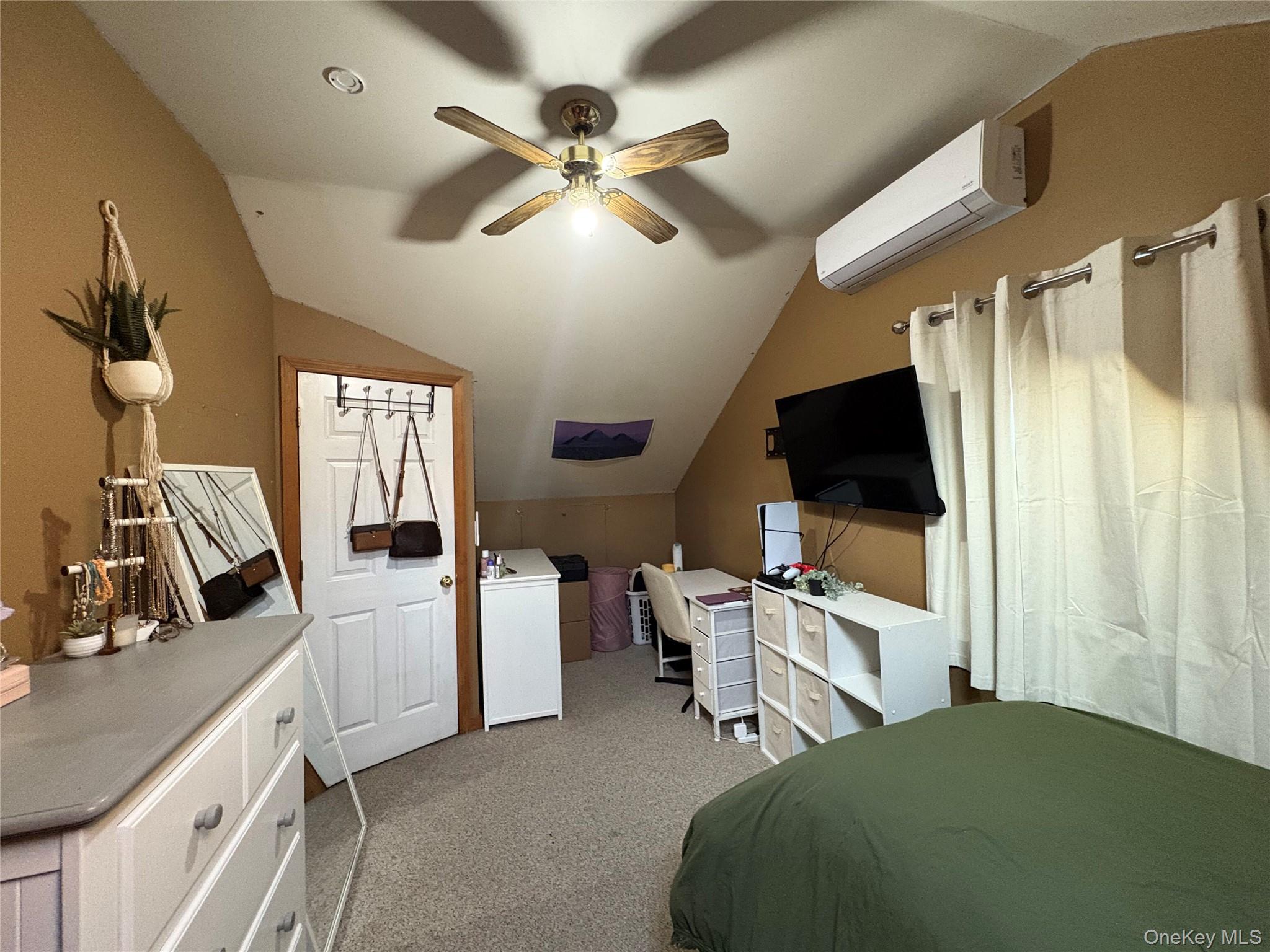40 Alton Road Babylon, NY 11702 - Photo 28 of 41 Bedroom featuring, light colored carpet, ceiling fan, and an AC wall unit