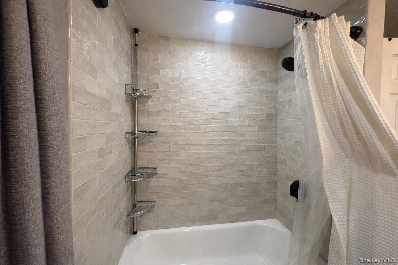 40 Alton Road Babylon, NY 11702 - Photo 32 of 41 Bathroom featuring shower / bath combination with curtain