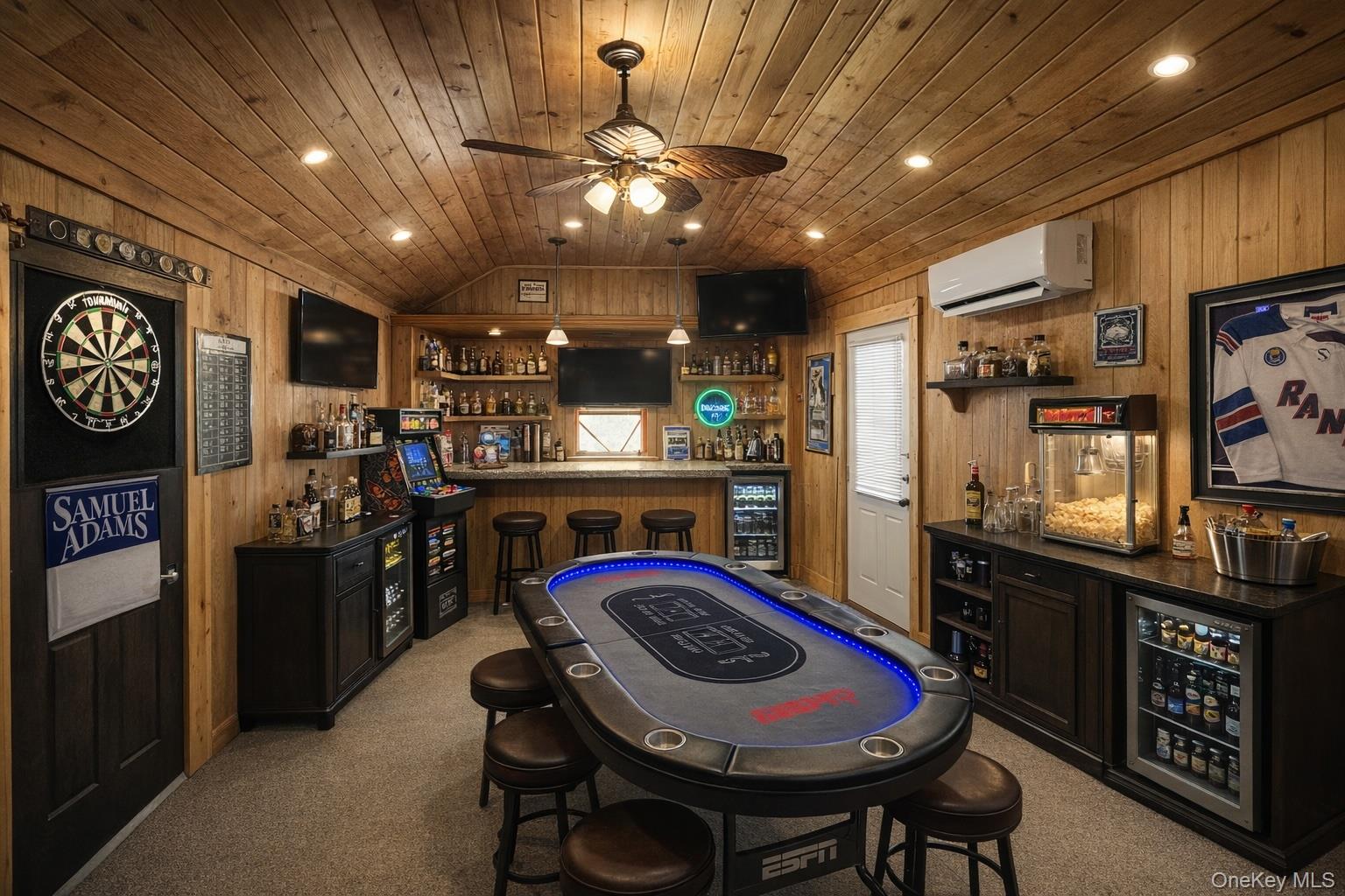 40 Alton Road Babylon, NY 11702 - Photo 35 of 41 Indoor bar / game room with dark countertops, open shelves, wood walls, lofted ceiling, and wood ceiling