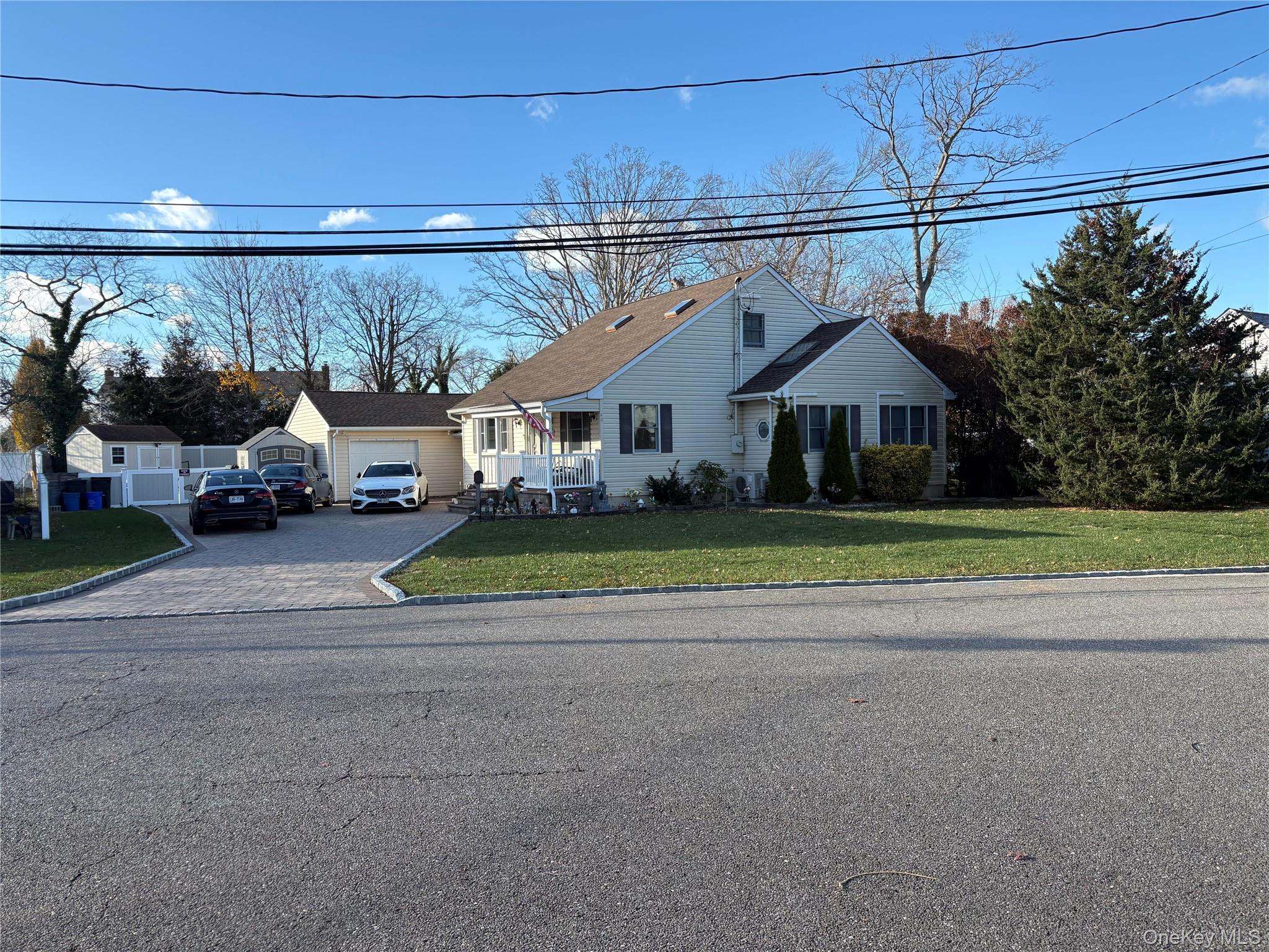 40 Alton Road Babylon, NY 11702 - Photo 4 of 41 View of front of home with driveway and a front yard