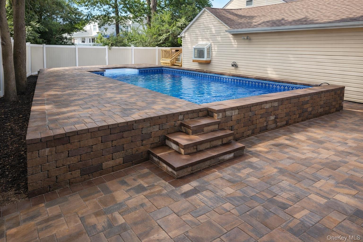 40 Alton Road Babylon, NY 11702 - Photo 8 of 41 View of pool in the summer featuring a patio and a fenced backyard