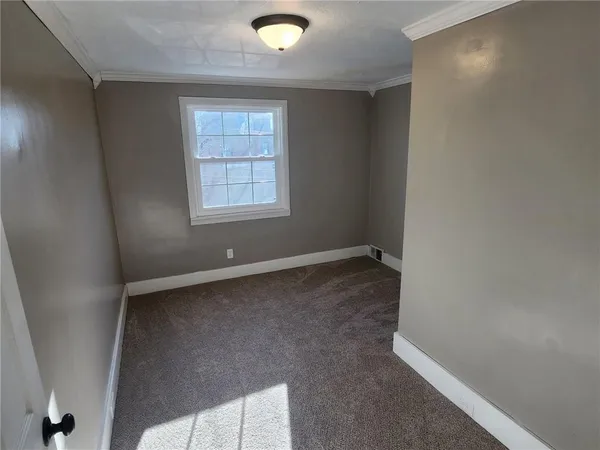 a view of a window in an empty room