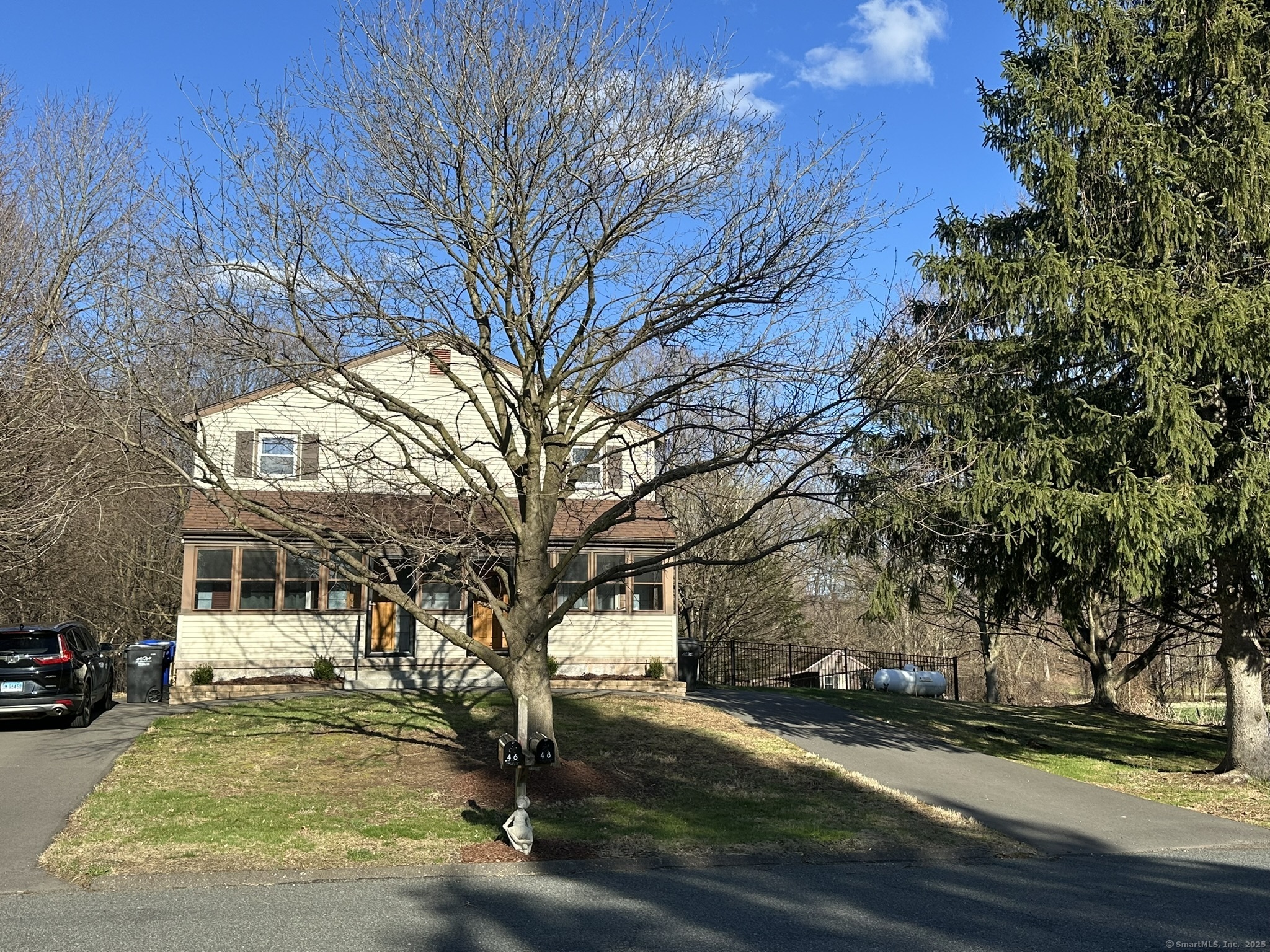 a view of a yard with a tree