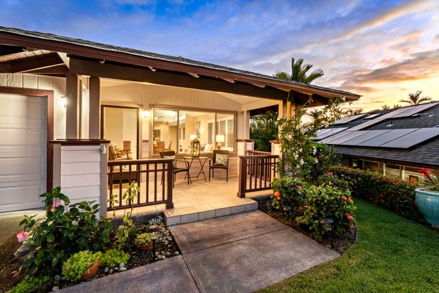 a outdoor space with a large window and couches