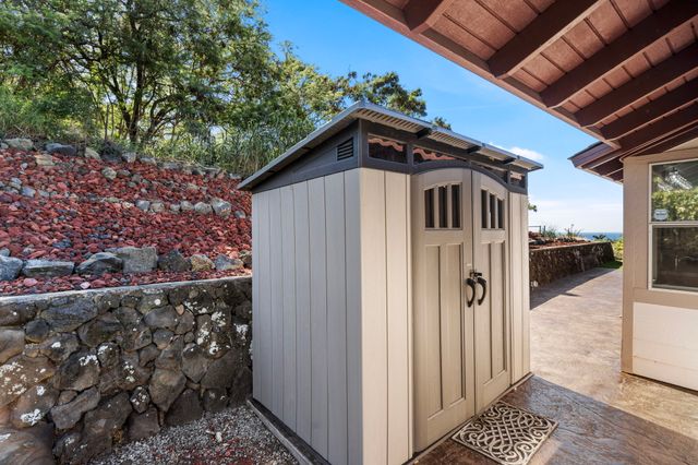 a aerial view of a house with a yard