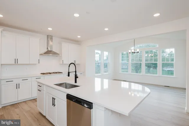 a kitchen with a sink and a refrigerator