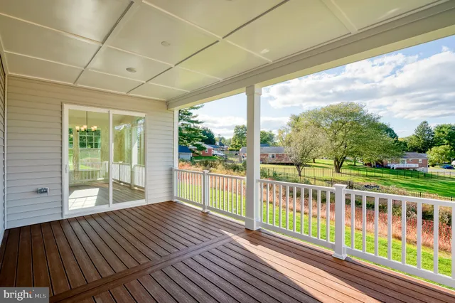 a view of a room with wooden floor and iron stairs
