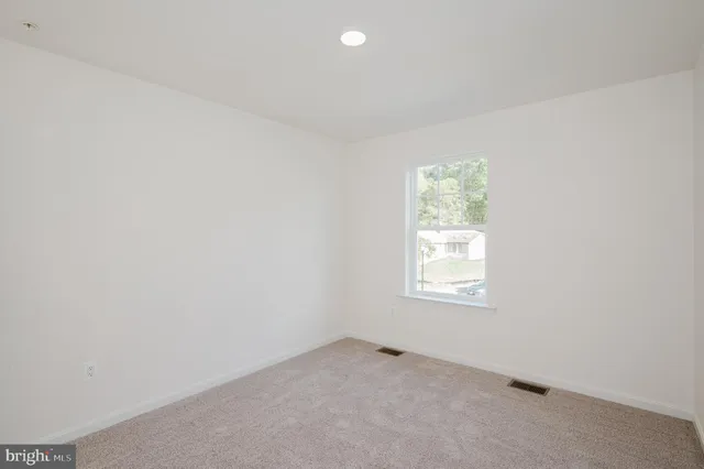 a bathroom with a double vanity sink toilet and a bathtub