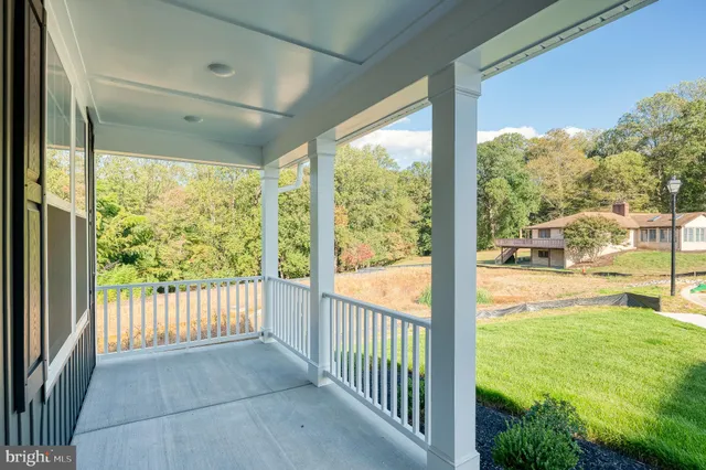 a view of a porch and garden