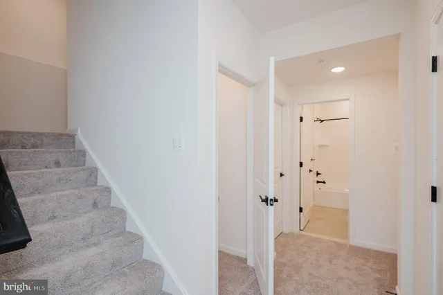 an empty room with a empty space and windows