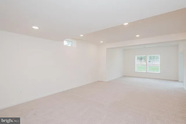 a view of a backyard with table and chairs under an umbrella