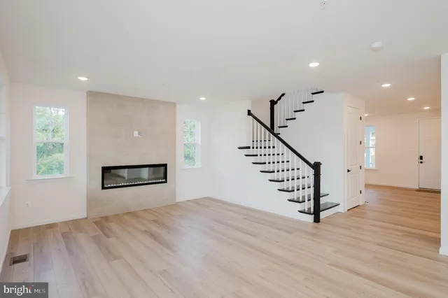 a view of a room with wooden floor and stairs