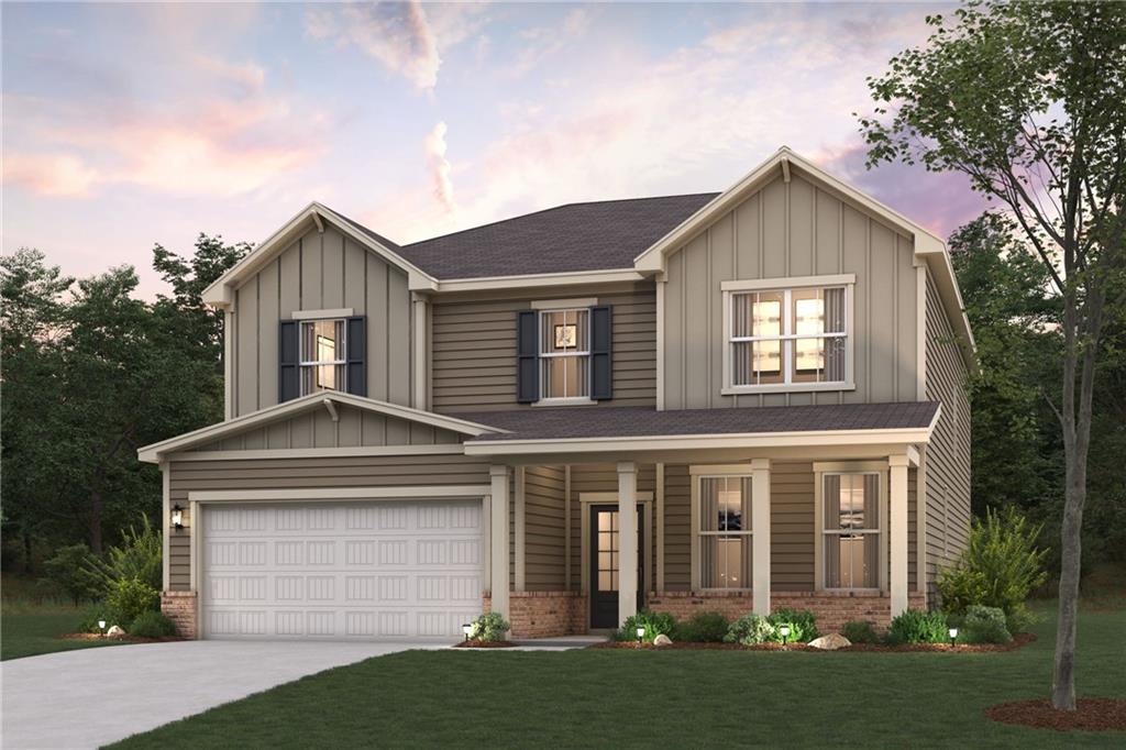 5611 Rosehall Place South Fulton, GA 30349 - Photo 1 of 1 a front view of a house with a yard and garage