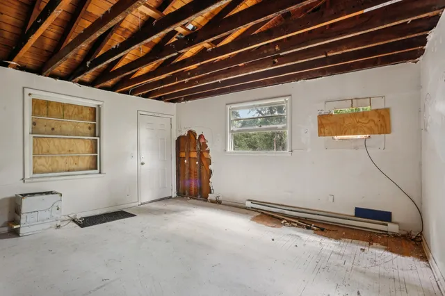 a view of a room with wooden walls