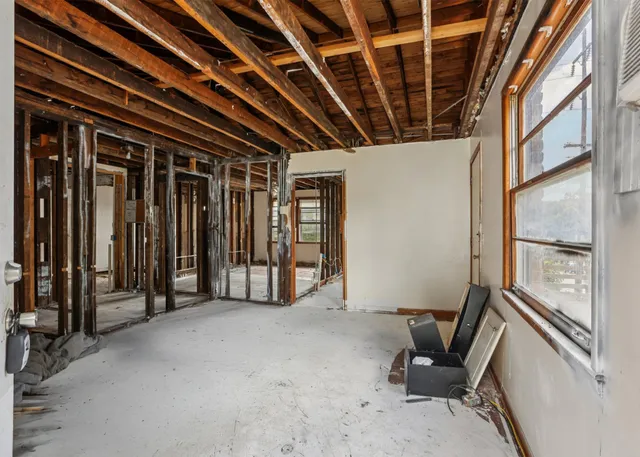 a view of an empty room with glass door
