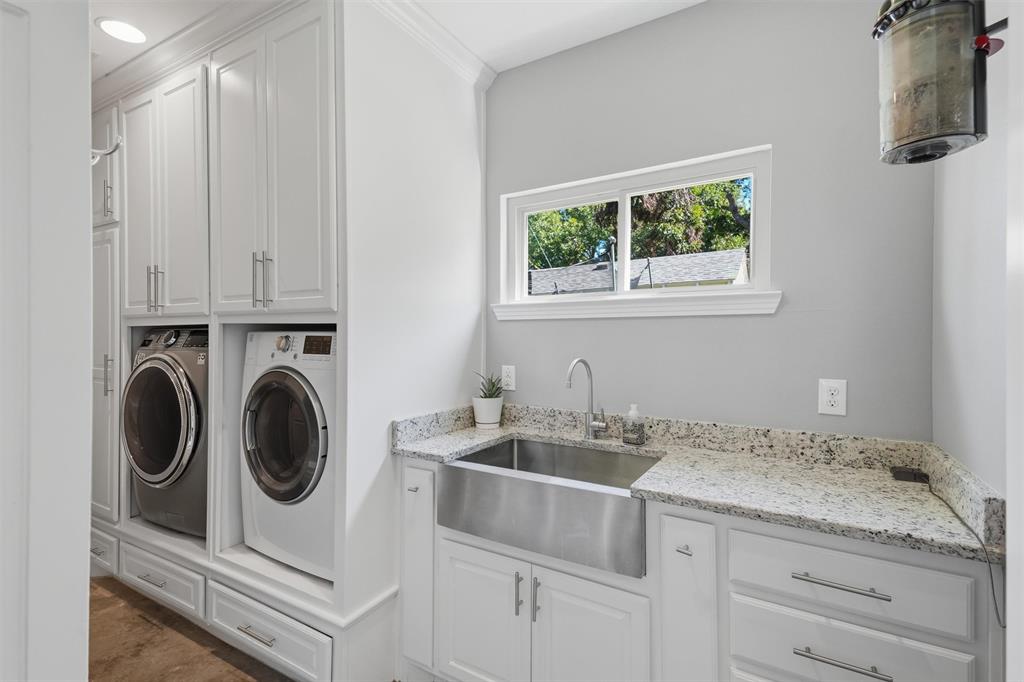 3712 Brighton Road Fort Worth, TX 76109 - Photo 22 of 33 Laundry room featuring built-ins as well as soaking/folding station.