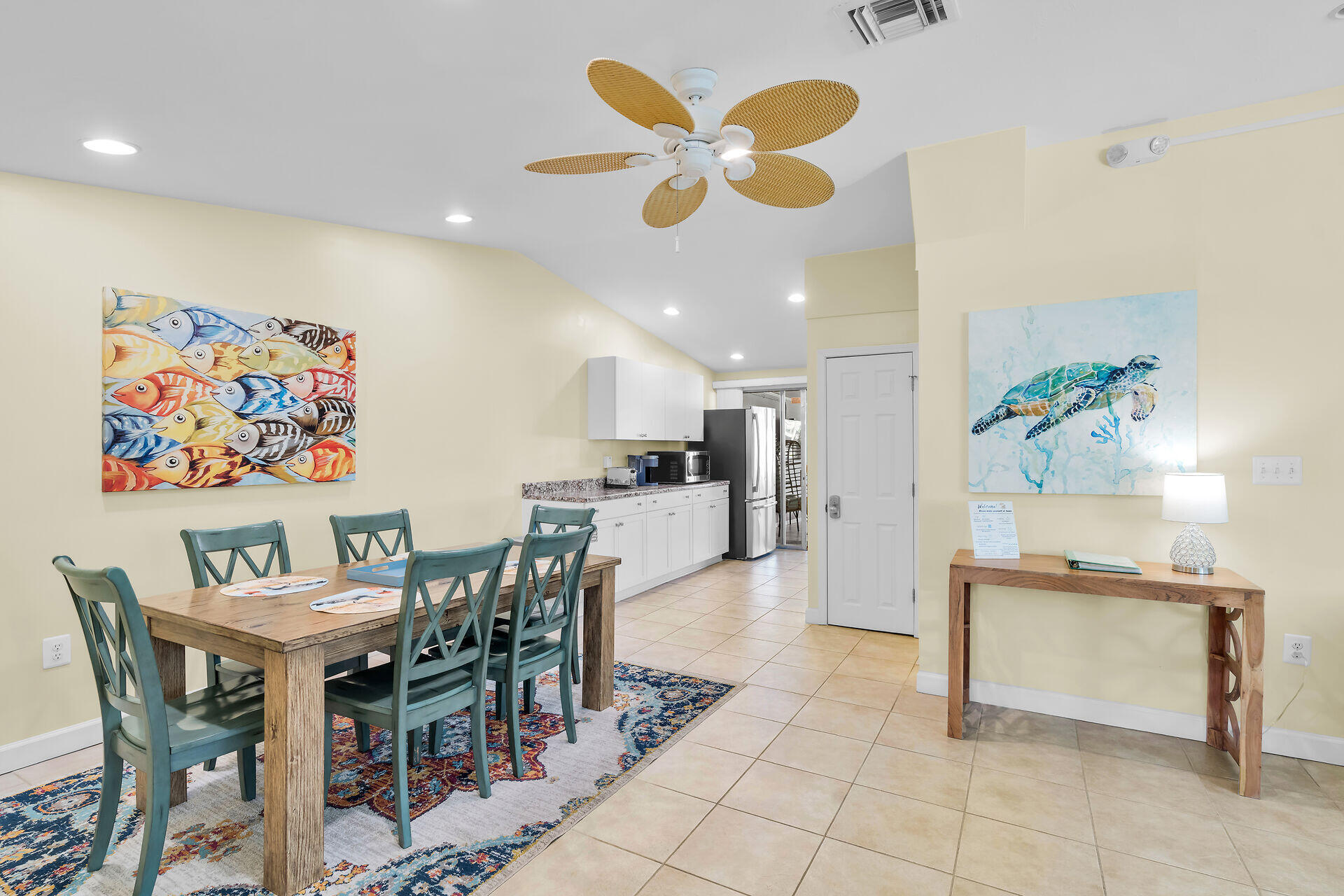 171 10th Street Key Colony Beach, FL 33051 - Photo 20 of 56 a view of a dining room with furniture and a chandelier