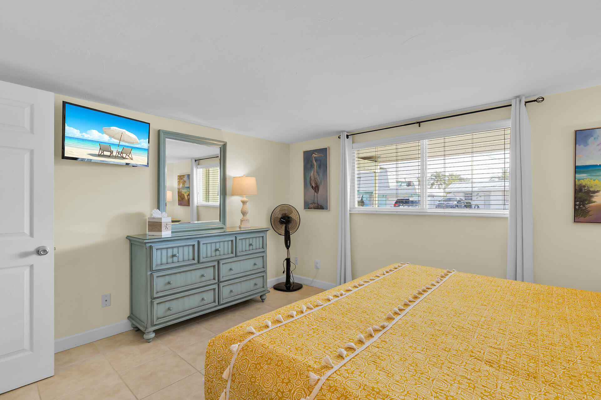 171 10th Street Key Colony Beach, FL 33051 - Photo 27 of 56 a bedroom with a bed and a dresser