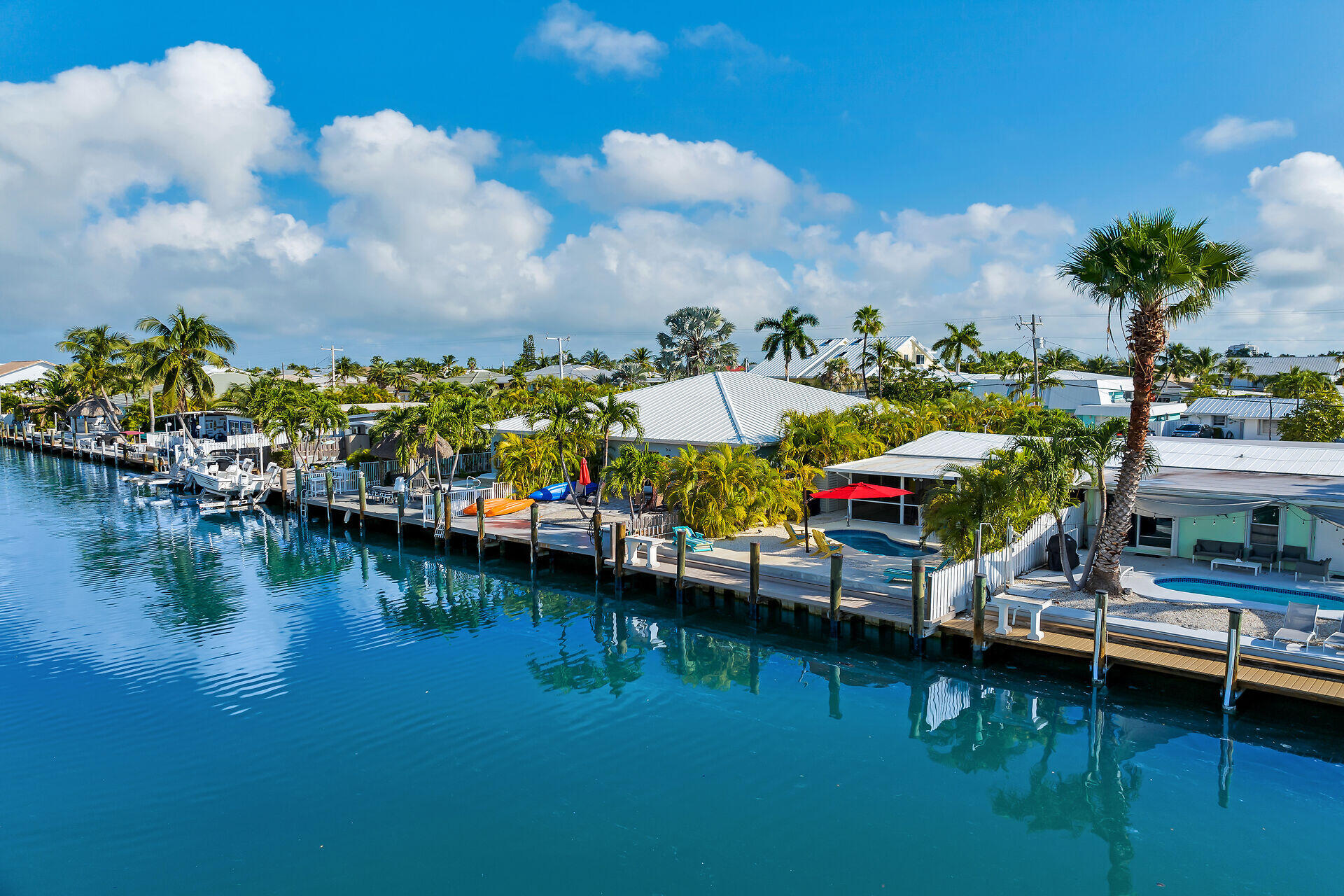 171 10th Street Key Colony Beach, FL 33051 - Photo 41 of 56 an aerial view of houses and lake