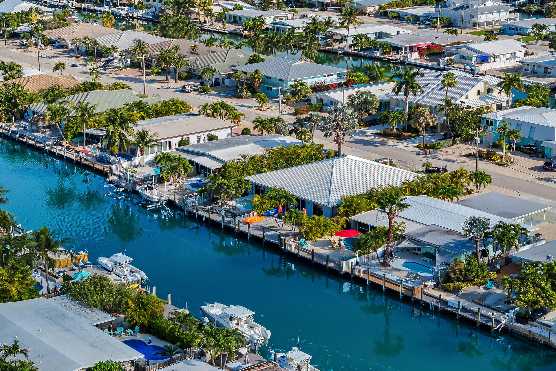 171 10th Street Key Colony Beach, FL 33051 - Photo 44 of 56 an aerial view of residential houses with outdoor space and lake view