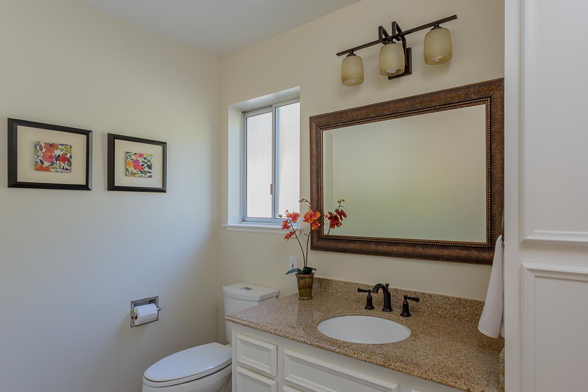 377 Rider Ridge Road Santa Cruz, CA 95065 - Photo 17 of 25 a bathroom with a granite countertop sink toilet and a mirror