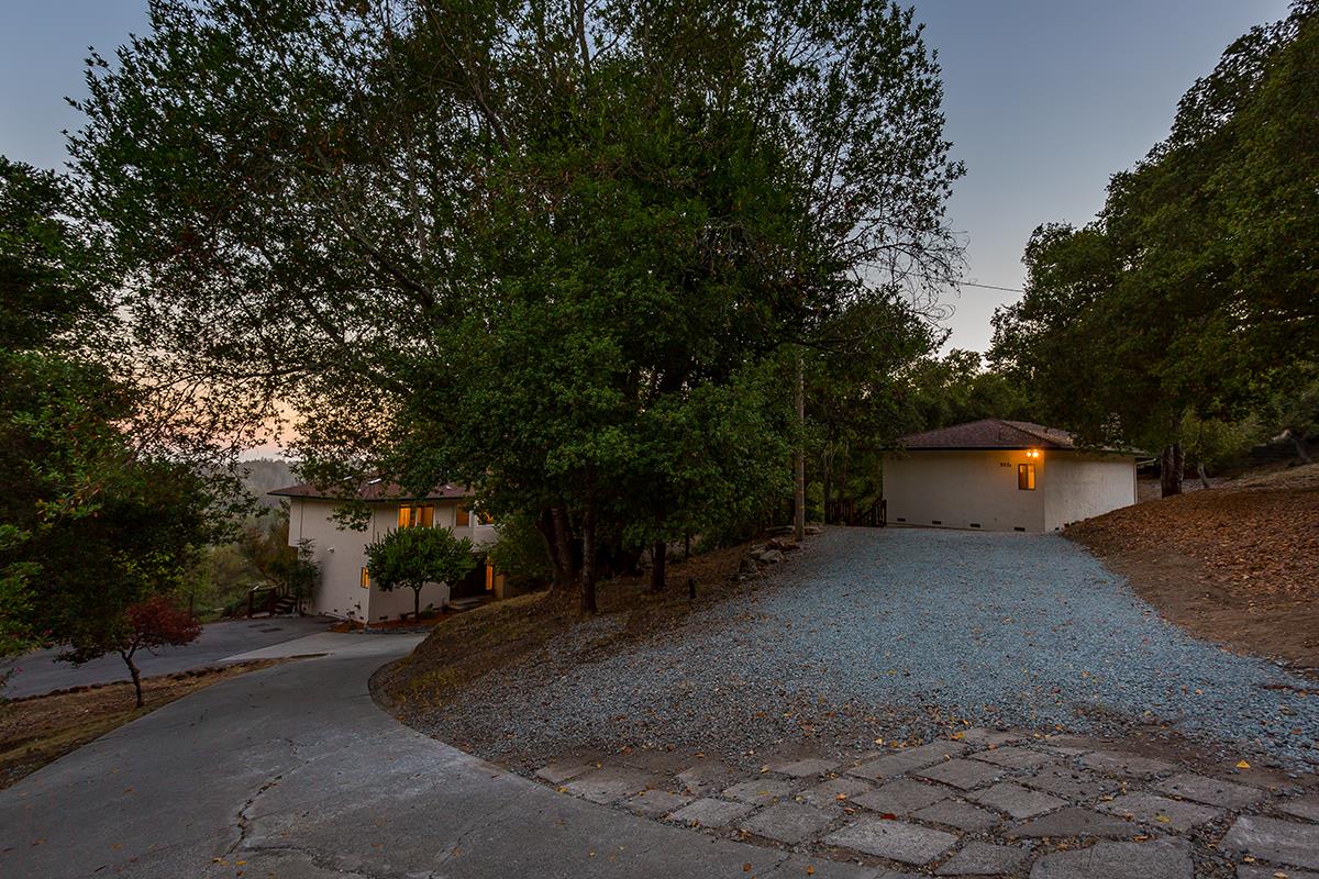 377 Rider Ridge Road Santa Cruz, CA 95065 - Photo 20 of 25 a backyard of a house with plants and trees